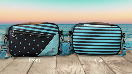 A crossbody bag shown from both front and back, featuring turquoise and black stripes, black with light blue polka dots, and a light blue chevron panel. The bag is displayed against a beach sunset background on a wooden surface, labeled 'Front' and 'Back'.